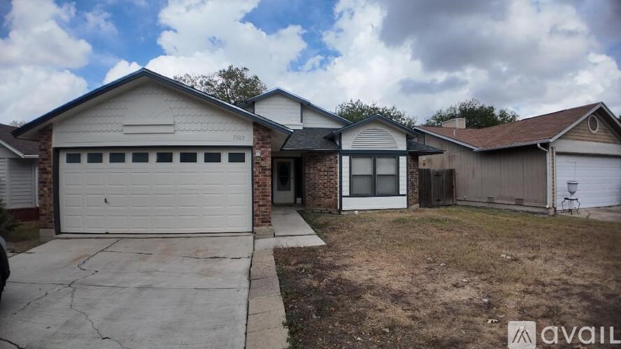 A house with a garage is available for sale.