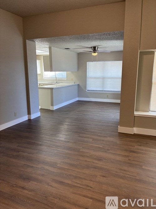 A bathroom with a toilet, sink, and bathtub.