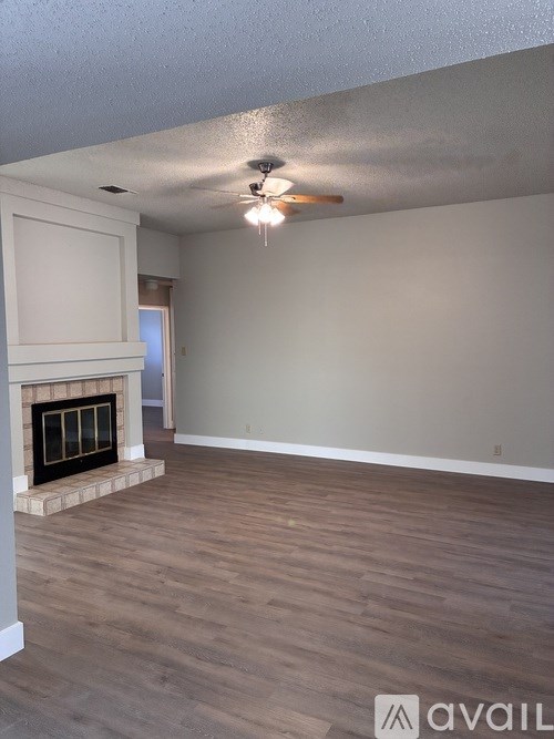 A bathroom with a toilet, sink, and mirror.
