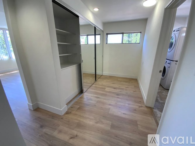 A laundry room with a washer and dryer.