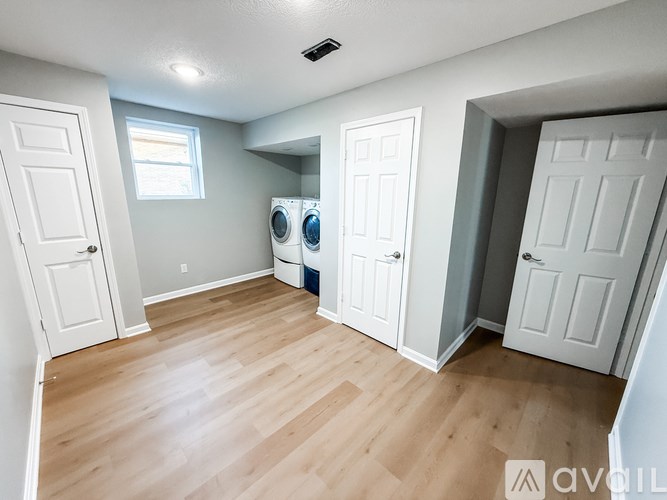 A room with a ceiling fan and a window.