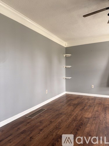 A room with wooden floors and a white ceiling.