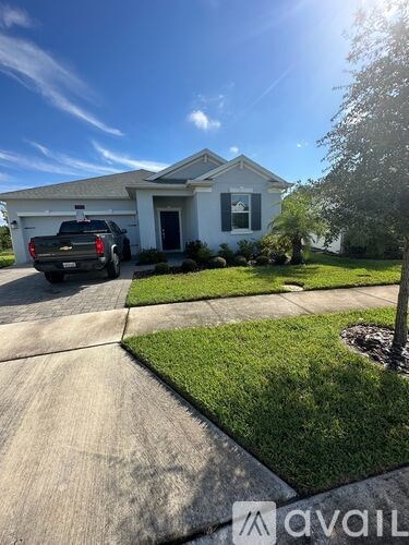 A house with a truck parked in front.
