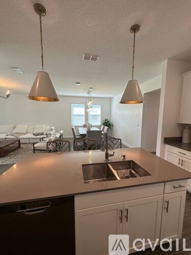 A kitchen with a sink and a countertop.
