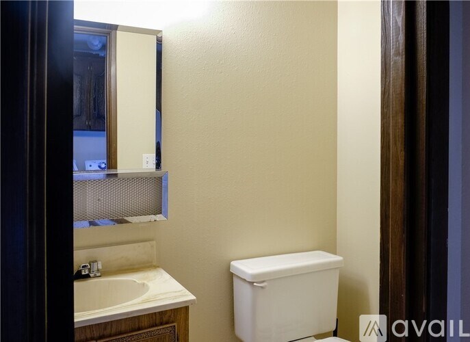 A bathroom with a toilet and a sink.