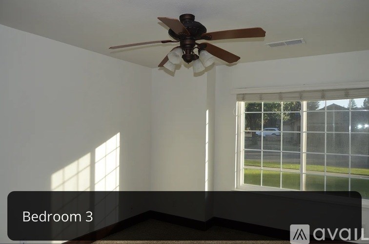 Bedroom 3 has a ceiling fan and a window.