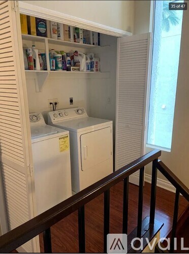A small kitchen with a white fridge and a white dishwasher.