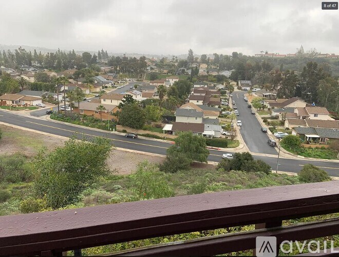 A view of a residential area from a balcony.