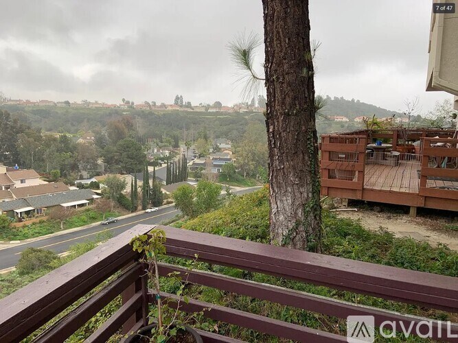 A view from a balcony overlooking a residential area.