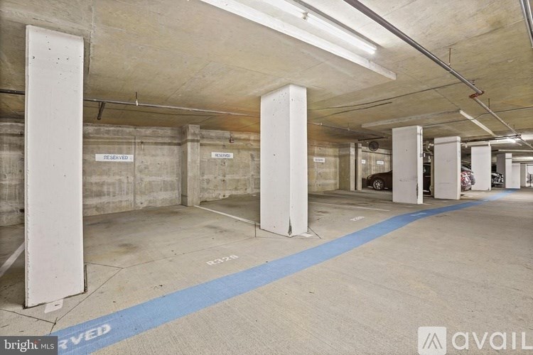 A parking garage with a blue line painted on the ground.