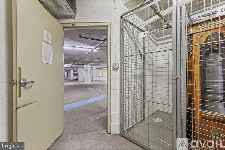 A metal gate is blocking the door to a room.