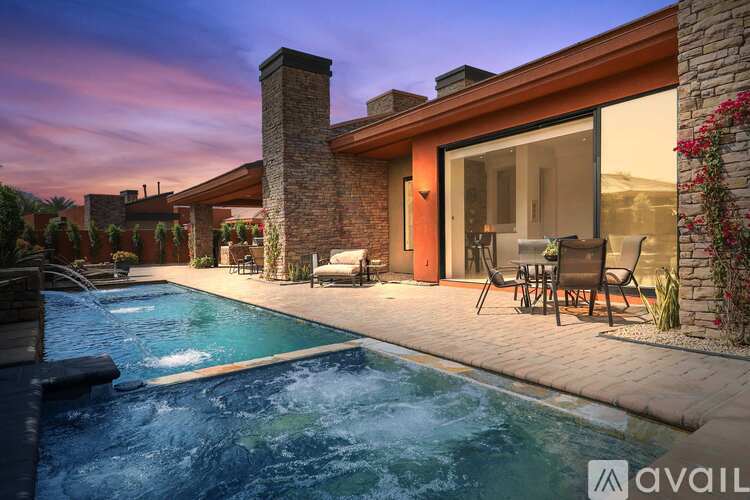 A modern house with a pool in the backyard.