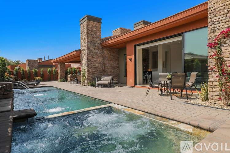 A modern house with a pool in the backyard.
