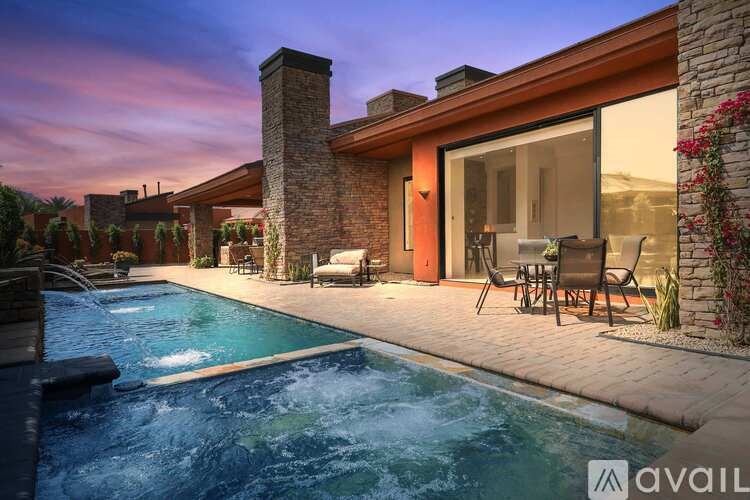 A modern house with a pool in the backyard.