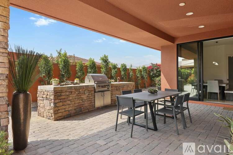 A patio with a table and chairs is shown.