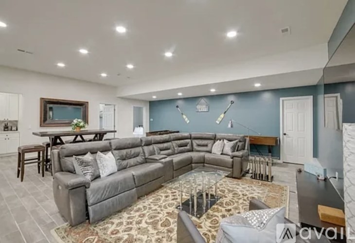 A living room with a grey sofa and a coffee table.