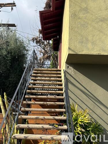 A staircase with wooden steps and metal railings.