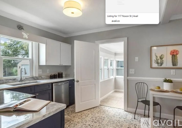 A kitchen with a dining table and chairs in it.