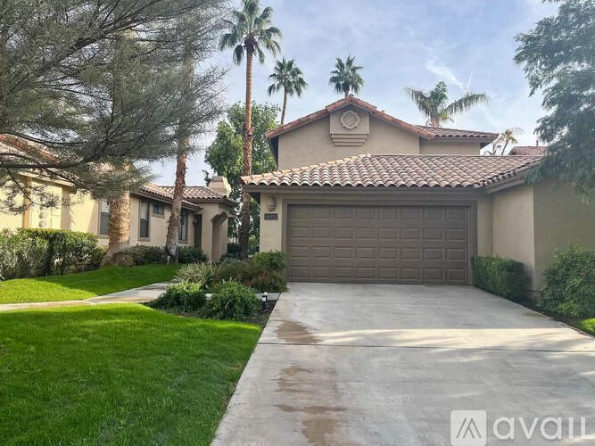 A house with a brown garage door is for sale.