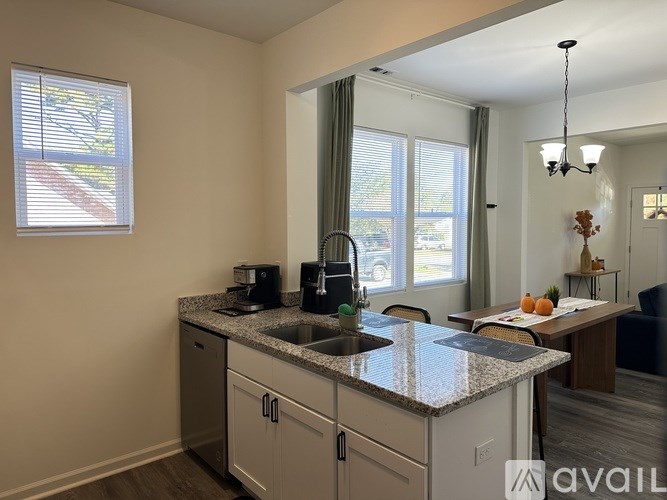 A kitchen with granite countertops and a sink.