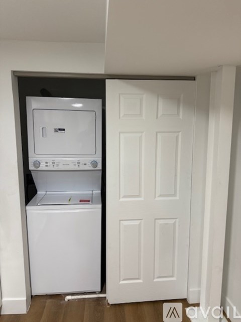 A white washer and dryer in a small laundry room.