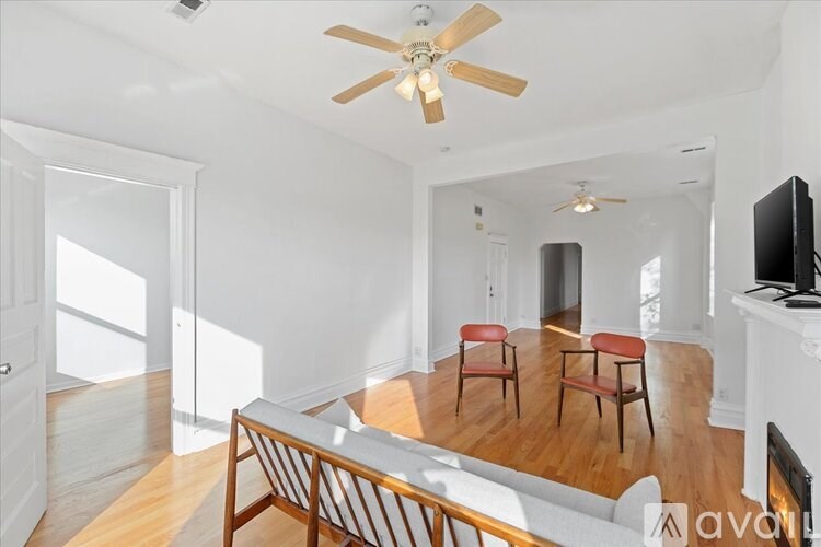 A living room with a fireplace and a television.