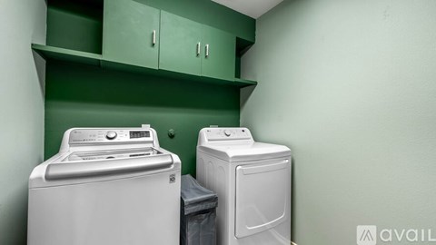 A washing machine and dryer in a laundry room.
