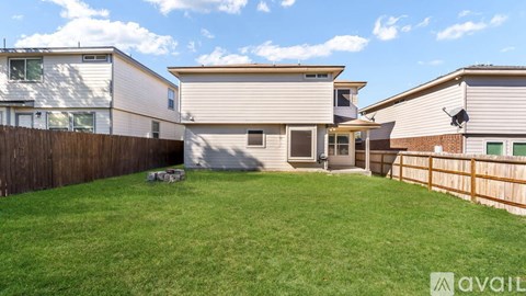 A house with a fence and a lawn is for sale.