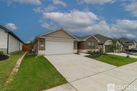 A house with a garage is available for sale.