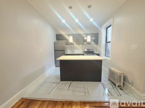 A kitchen with a large island in the middle of the room.