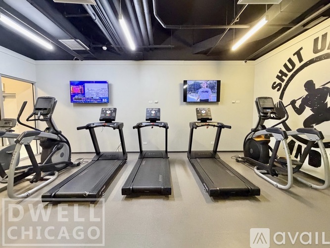 A gym with treadmills and exercise bikes.