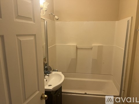 A bathroom with a sink, toilet and bathtub.