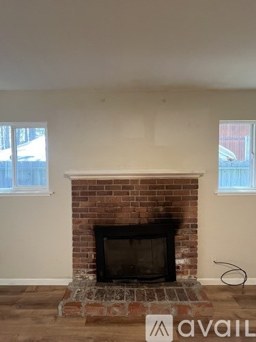 A brick fireplace with a fire place in the middle.