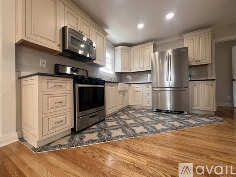 A kitchen with wooden cabinets and stainless steel appliances.