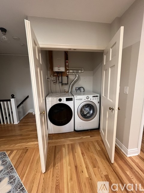 A laundry room with a washer and dryer in it.