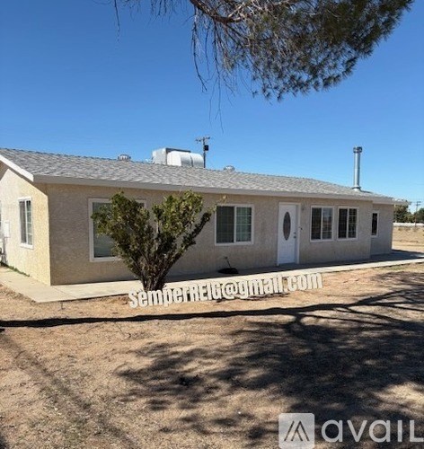 A house with a tree in front and a sign that says "semperrego.com".