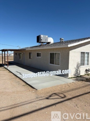 A house with a roof mounted air conditioner unit.