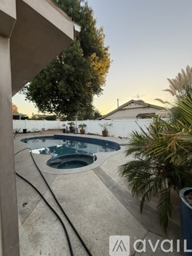 A pool with a hose attached to it.