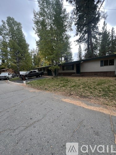 A house with a driveway in front of it.
