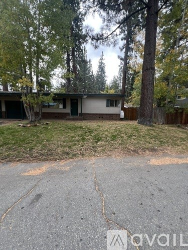 A house with a driveway in front of it.
