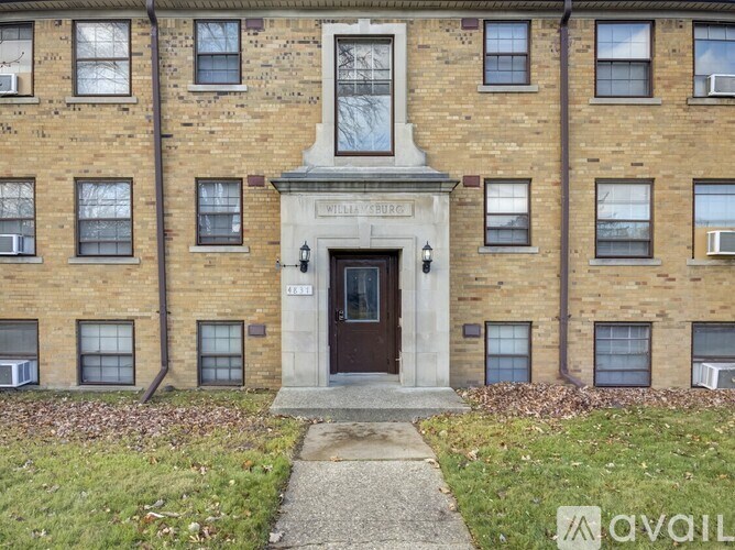 The front of a brick building with the words "Wellington Church" written on it.