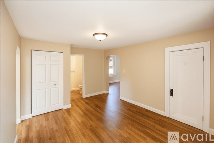 A room with wooden floors and white walls.