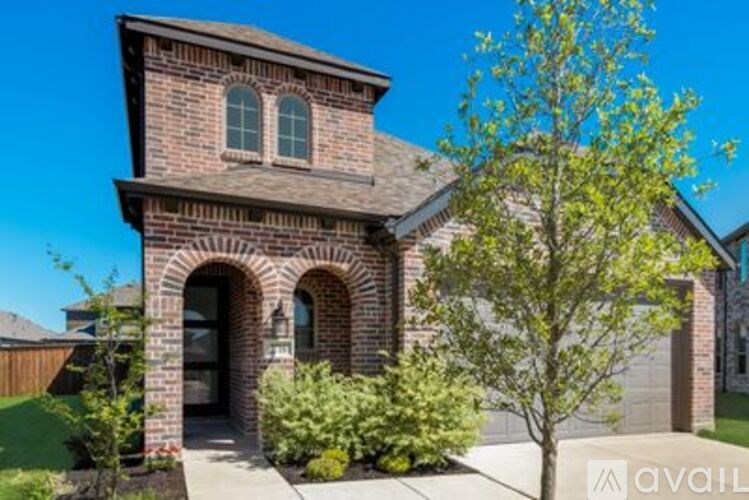 A house with a tree in front of it.