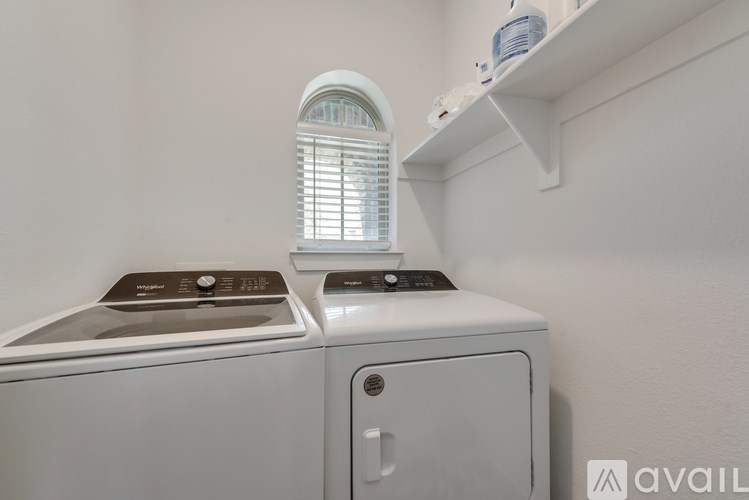 A washing machine and dryer are stacked on top of each other.