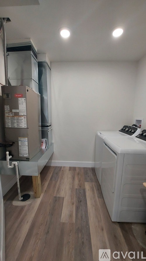 A laundry room with a washer and dryer.