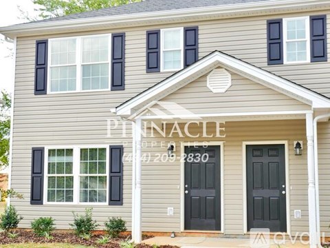A house with the name Pinnacle on the front.