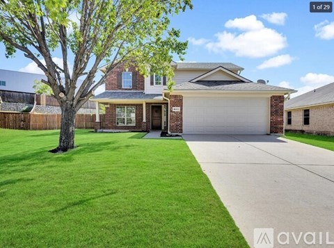 A house with a tree in front of it.