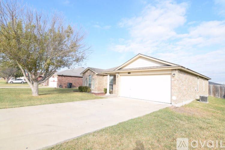 A house with a garage is available for sale.
