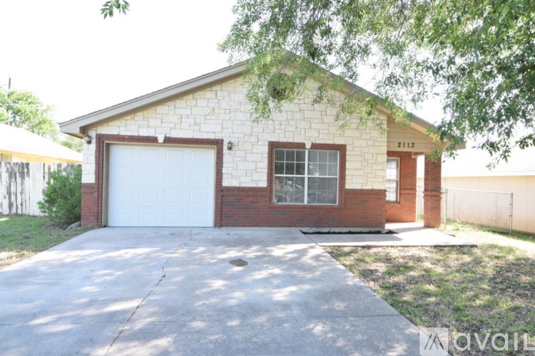 A house with a garage and a driveway.