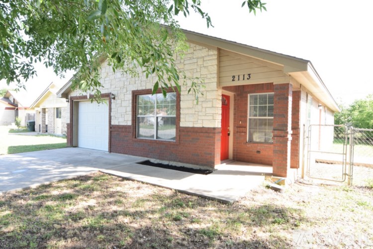 A house with the number 2113 on the front door.